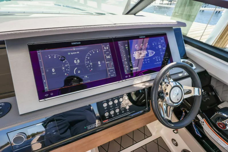  Yacht Photos Pics 2023 Sea Ray SLX 400 Outboard dashboard with dual Simrad displays and steering wheel.