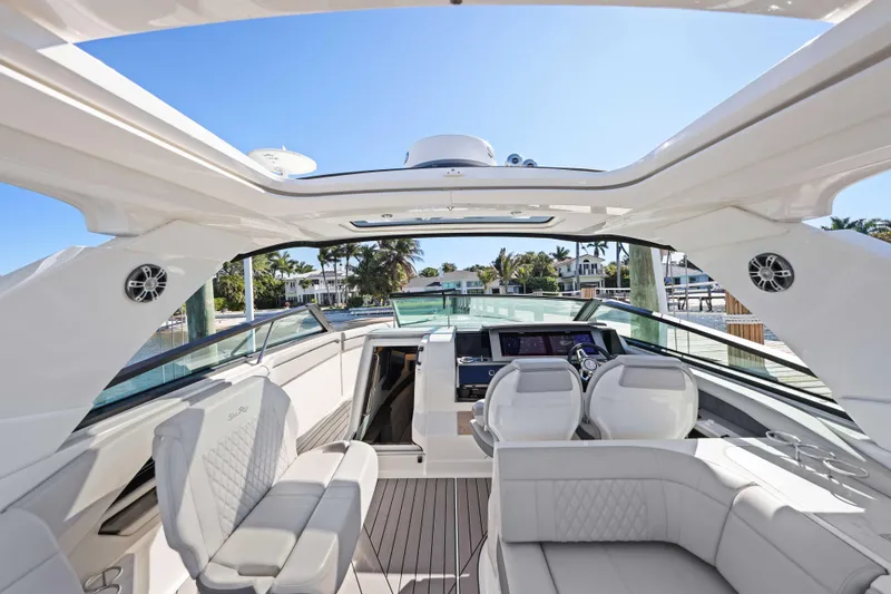  Yacht Photos Pics 2023 Sea Ray SLX 400 Outboard interior with luxurious seating and modern dashboard.