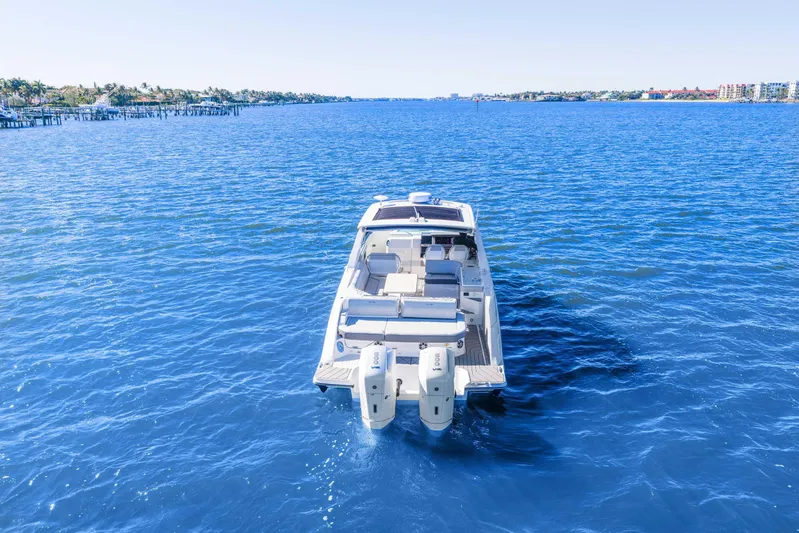  Yacht Photos Pics 2023 Sea Ray SLX 400 Outboard cruising on clear blue water.
