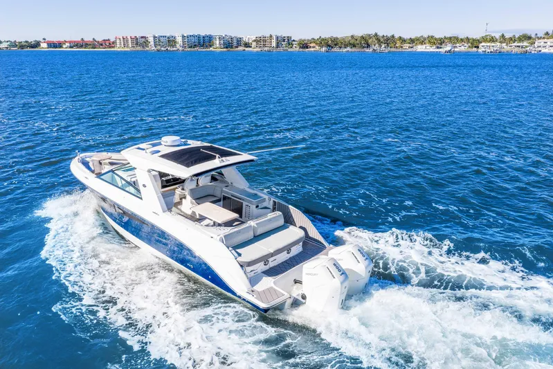  Yacht Photos Pics 2023 Sea Ray SLX 400 Outboard cruising on open blue water.