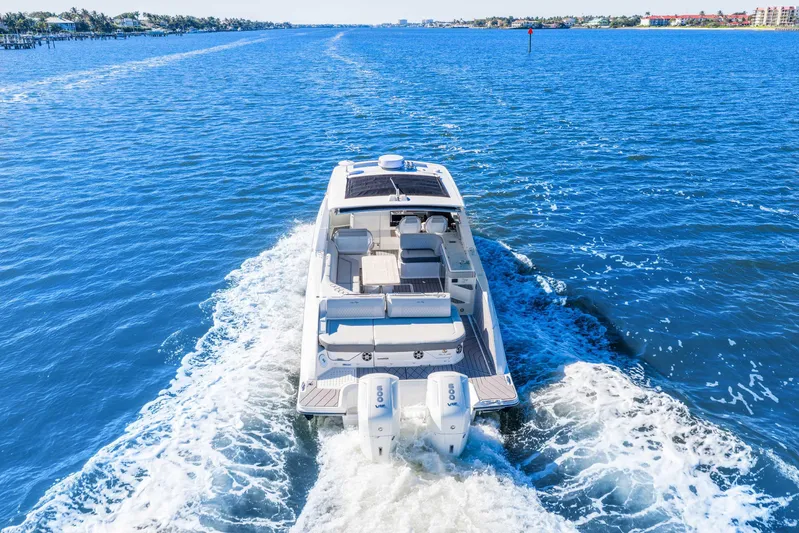  Yacht Photos Pics 2023 Sea Ray SLX 400 Outboard cruising on open blue water.