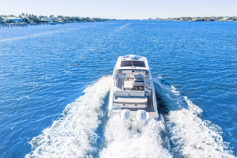  Yacht Photos Pics 2023 Sea Ray SLX 400 Outboard cruising on open blue water.