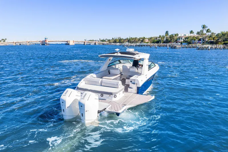  Yacht Photos Pics 2023 Sea Ray SLX 400 Outboard cruising on a sunny day in a scenic waterway.