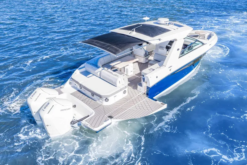  Yacht Photos Pics 2023 Sea Ray SLX 400 Outboard cruising on open water, showcasing luxury and performance.