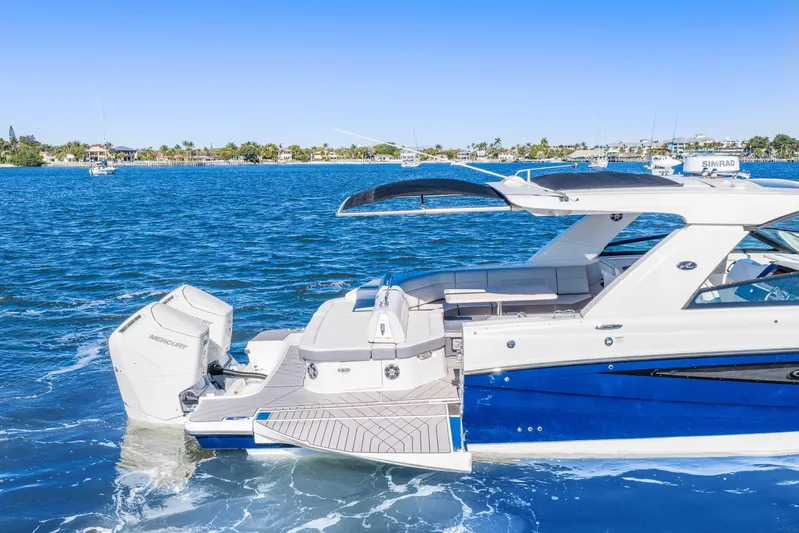  Yacht Photos Pics 2023 Sea Ray SLX 400 Outboard cruising on a sunny day, showcasing luxury and performance.
