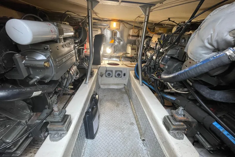 Reel It In Yacht Photos Pics Engine room of 2003 Ocean Yachts 40 Super Sport, showcasing mechanical components and wiring.