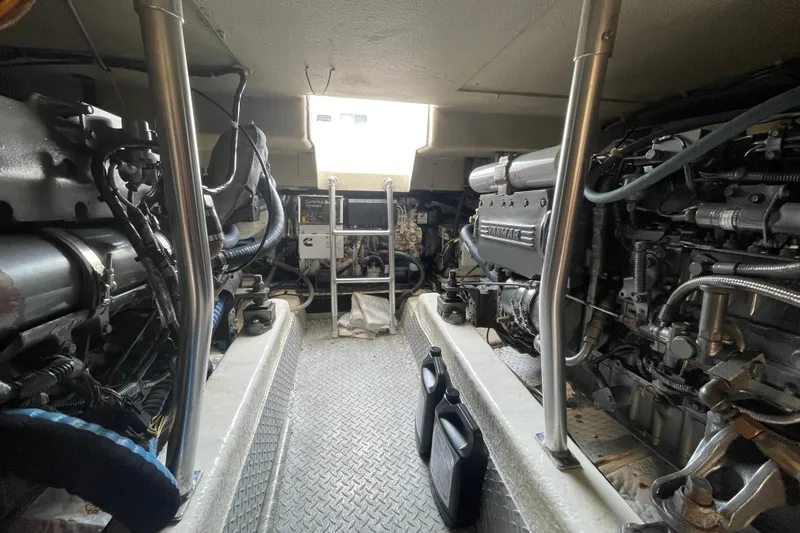 Reel It In Yacht Photos Pics Engine room of 2003 Ocean Yachts 40 Super Sport, showcasing dual engines and equipment.