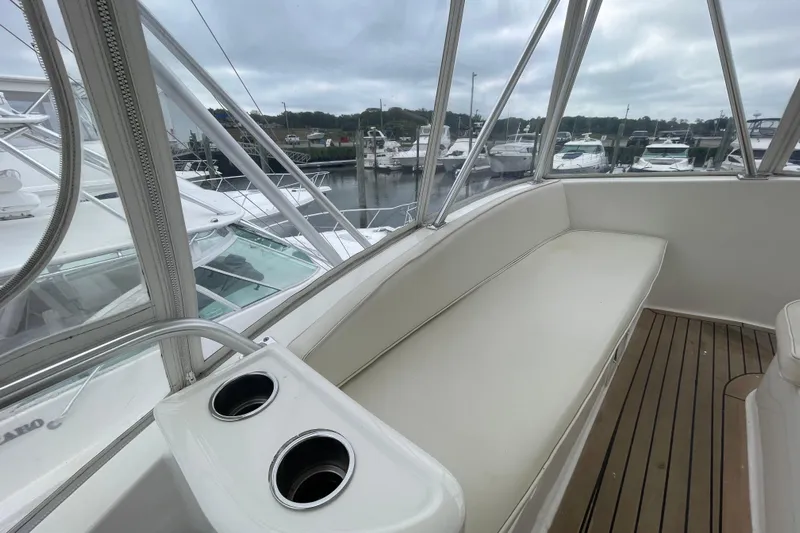 Reel It In Yacht Photos Pics 2003 Ocean Yachts 40 Super Sport interior with cushioned seating and cup holders.