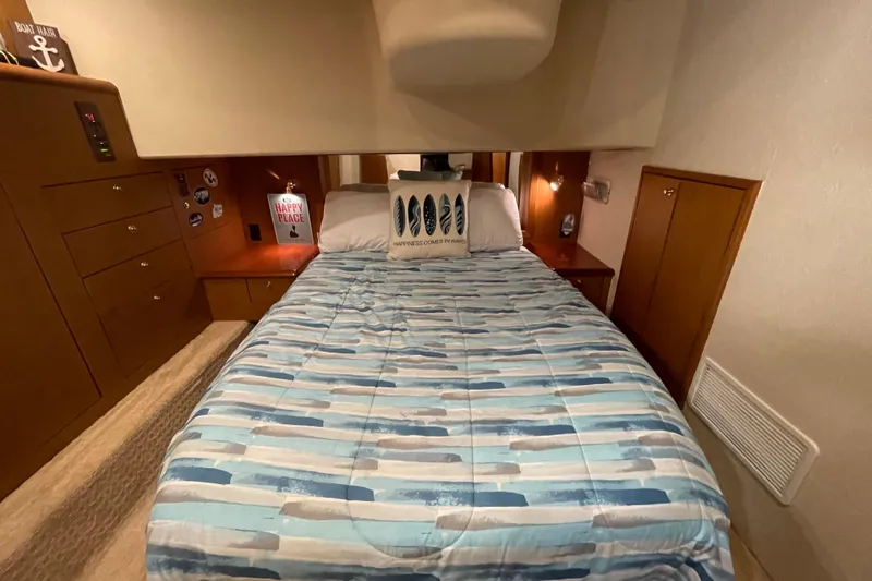 Reel It In Yacht Photos Pics Cozy bedroom in 2003 Ocean Yachts 40 Super Sport with nautical decor.