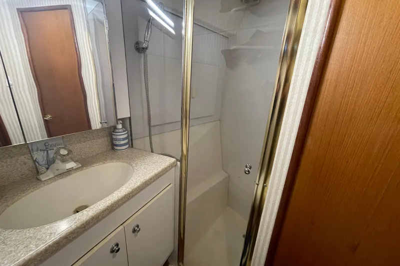 Reel It In Yacht Photos Pics Bathroom interior of 2003 Ocean Yachts 40 Super Sport with shower and sink.