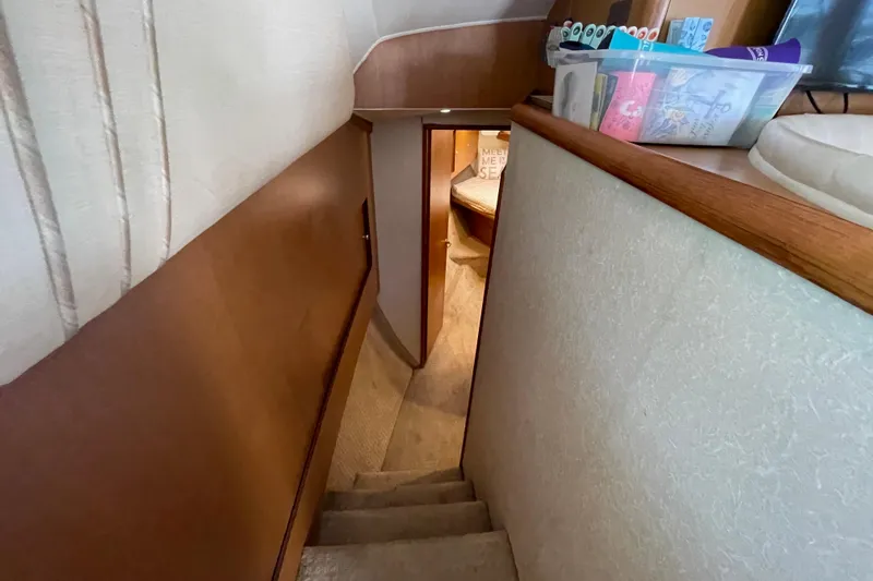 Reel It In Yacht Photos Pics Interior view of 2003 Ocean Yachts 40 Super Sport, featuring a cozy stairway and cabin.