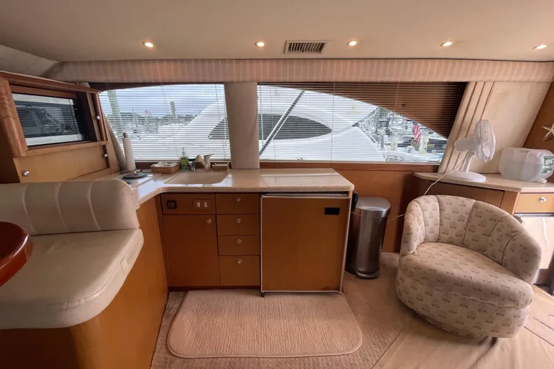 Reel It In Yacht Photos Pics Interior of 2003 Ocean Yachts 40 Super Sport with cozy seating and kitchenette.