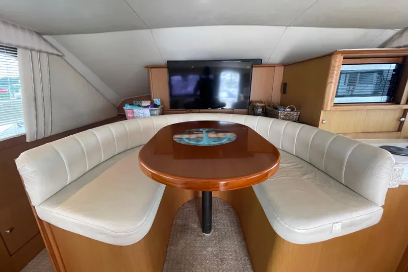 Reel It In Yacht Photos Pics Interior of 2003 Ocean Yachts 40 Super Sport with curved seating and TV.