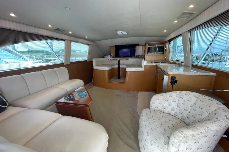 Reel It In Yacht Photos Pics Luxurious interior of 2003 Ocean Yachts 40 Super Sport with plush seating and modern amenities.