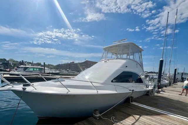 Reel It In Yacht Photos Pics 2003 Ocean Yachts 40 Super Sport docked under a clear blue sky.