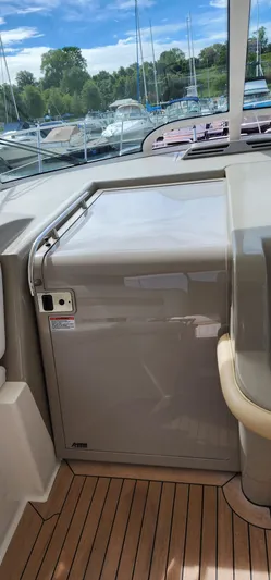  Yacht Photos Pics 2009 Sea Ray 500 Sundancer interior with sleek cabinetry and wooden flooring.