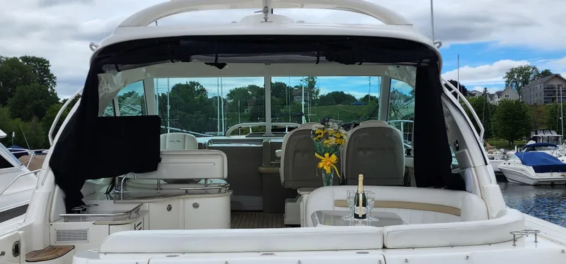  Yacht Photos Pics 2009 Sea Ray 500 Sundancer yacht with elegant interior and outdoor seating at a marina.