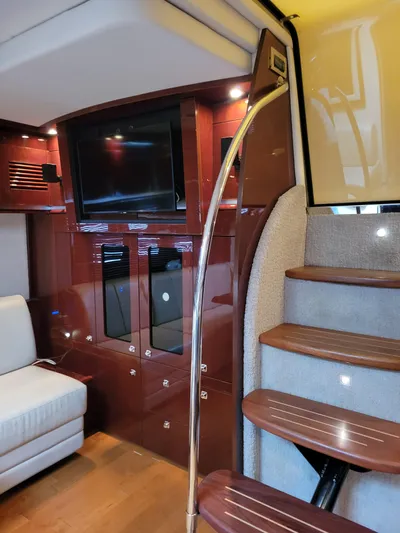  Yacht Photos Pics Interior of 2009 Sea Ray 500 Sundancer yacht with wooden stairs and modern entertainment area.