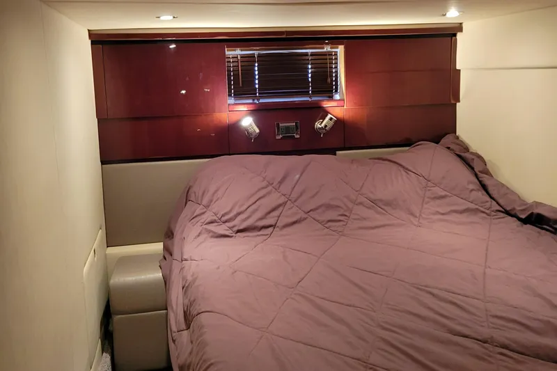  Yacht Photos Pics Luxurious bedroom interior of 2009 Sea Ray 500 Sundancer yacht with cozy bedding.