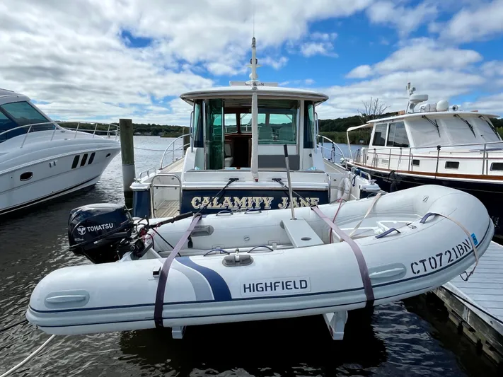 Calamity Jane Yacht Photos Pics 2018 Sabre 45 Salon Express with Highfield dinghy at marina.