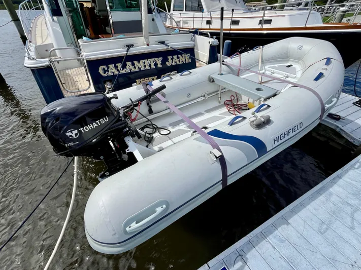 Calamity Jane Yacht Photos Pics Highfield inflatable boat with Tohatsu motor docked near Sabre 45 Salon Express, 2018 model.