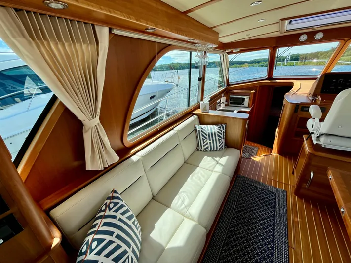 Calamity Jane Yacht Photos Pics Luxurious interior of 2018 Sabre 45 Salon Express yacht with elegant wood finish.