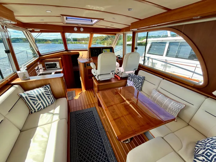 Calamity Jane Yacht Photos Pics Luxurious interior of 2018 Sabre 45 Salon Express yacht with elegant seating and wood finishes.