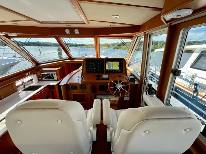 Calamity Jane Yacht Photos Pics Interior of 2018 Sabre 45 Salon Express yacht with helm and navigation system.