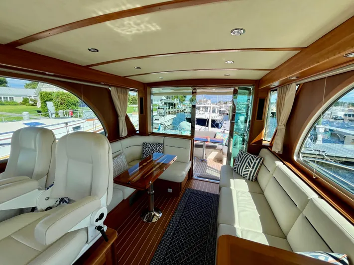 Calamity Jane Yacht Photos Pics Luxurious interior of 2018 Sabre 45 Salon Express yacht with plush seating and wood accents.