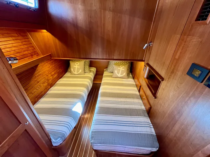 Calamity Jane Yacht Photos Pics Twin cabin with striped bedding in 2018 Sabre 45 Salon Express yacht.