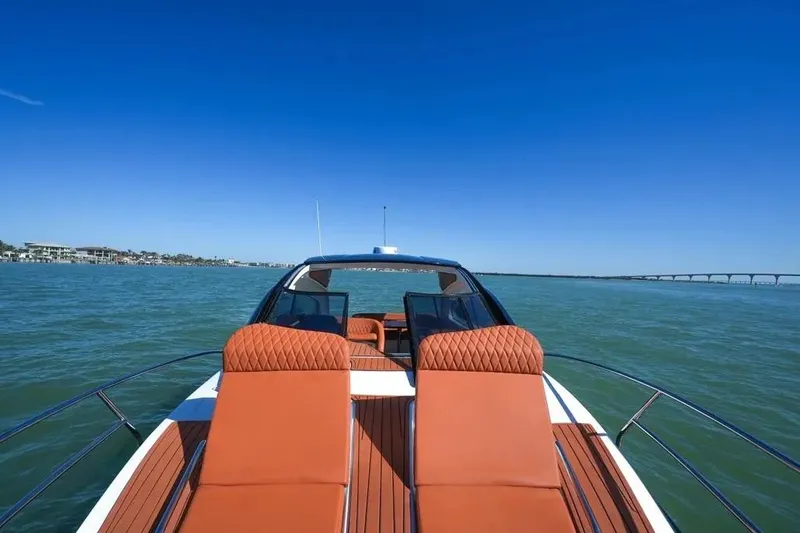  Yacht Photos Pics Luxurious Hanover 355 yacht, 2025 model, cruising on serene waters under a clear blue sky.