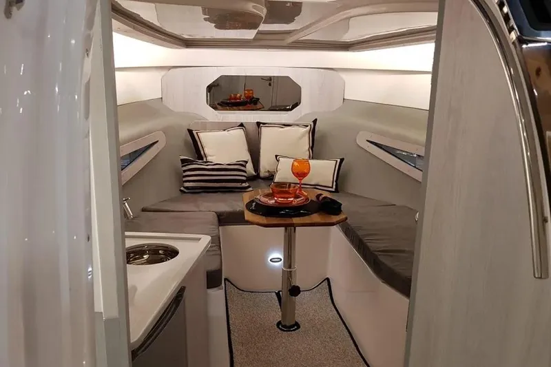  Yacht Photos Pics Luxurious interior of 2025 Hanover 355 boat with cozy seating and elegant decor.
