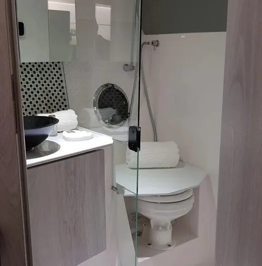  Yacht Photos Pics Compact bathroom with modern fixtures in Hanover 355, 2025 model.