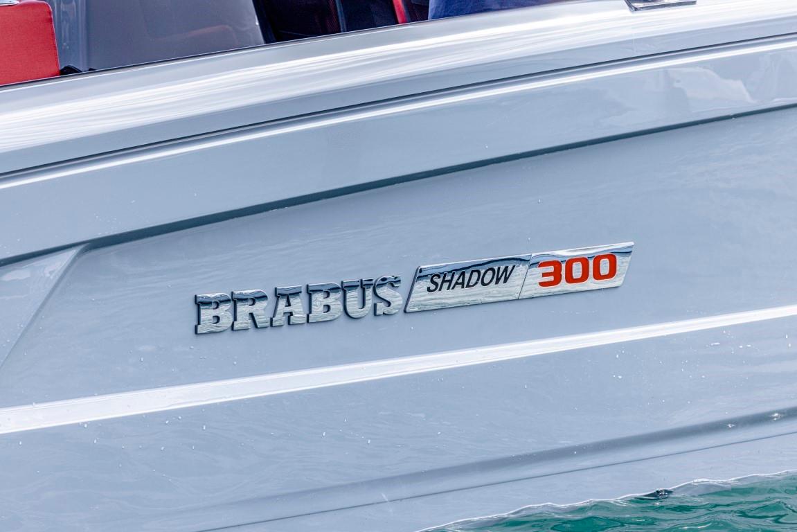 2024 BRABUS SHADOW 300 CT boat logo on sleek silver hull.