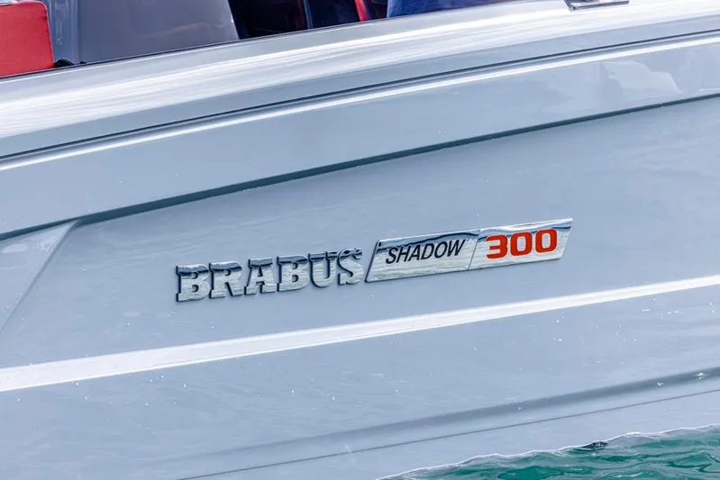  Yacht Photos Pics 2024 BRABUS SHADOW 300 CT boat logo on sleek silver hull.