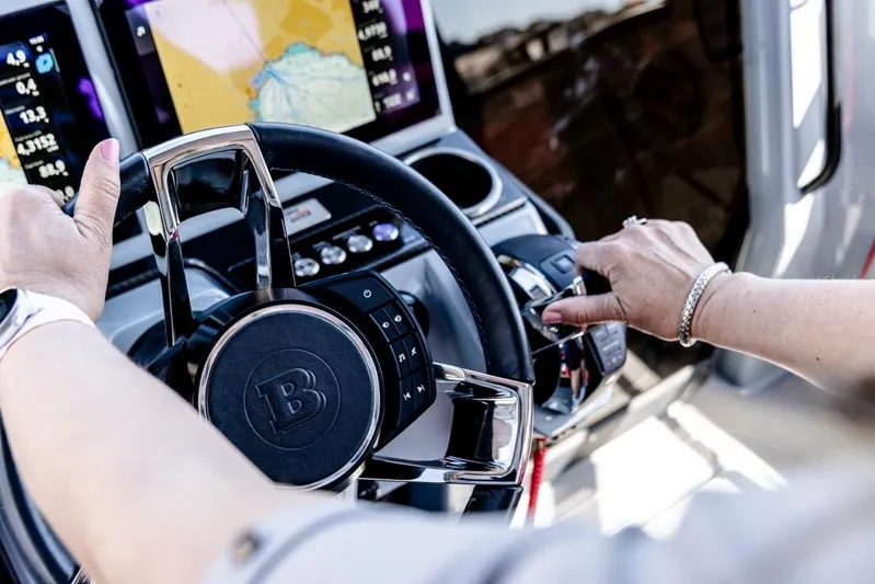  Yacht Photos Pics Steering wheel of 2024 BRABUS SHADOW 300 CT with navigation display in background.