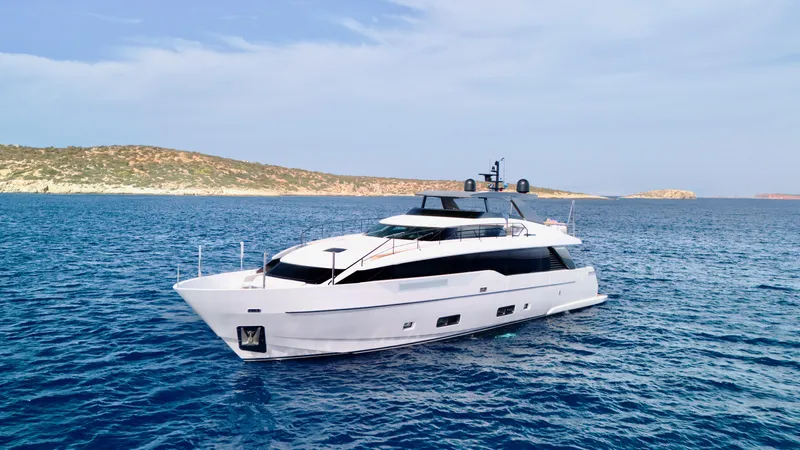 Judy Yacht Photos Pics 2024 Sanlorenzo SL90A yacht cruising on open sea with scenic coastline backdrop.