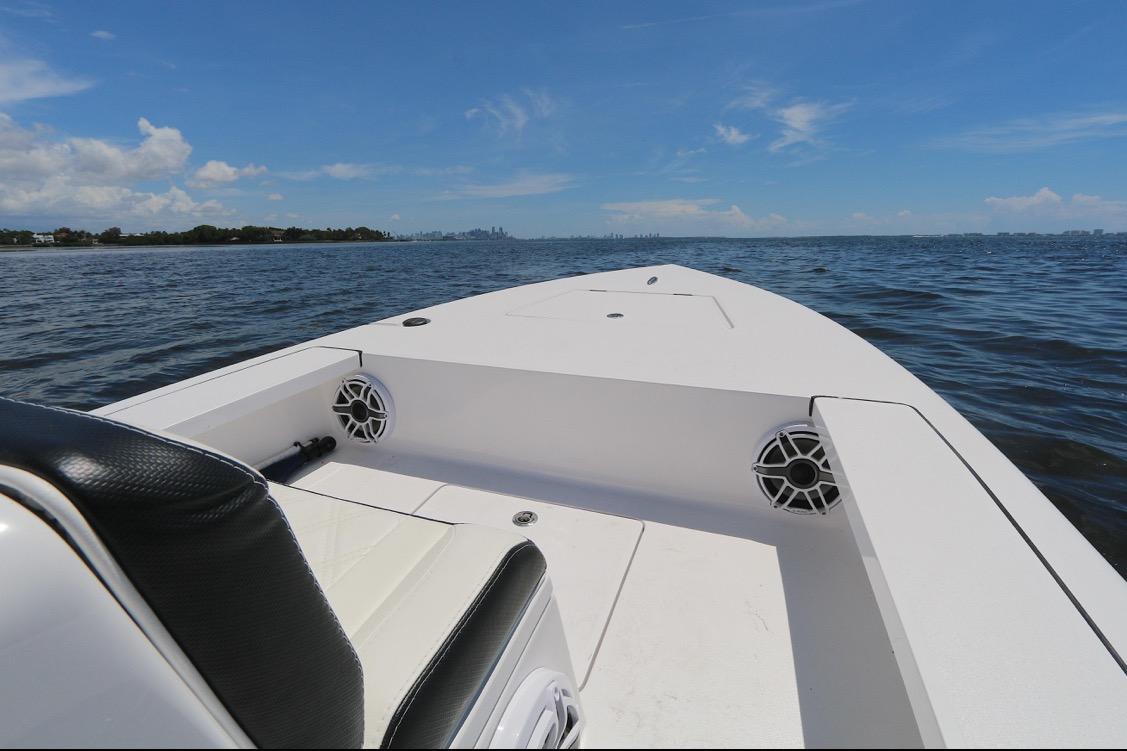 2024 Vtech 18 boat on open water under clear blue sky.