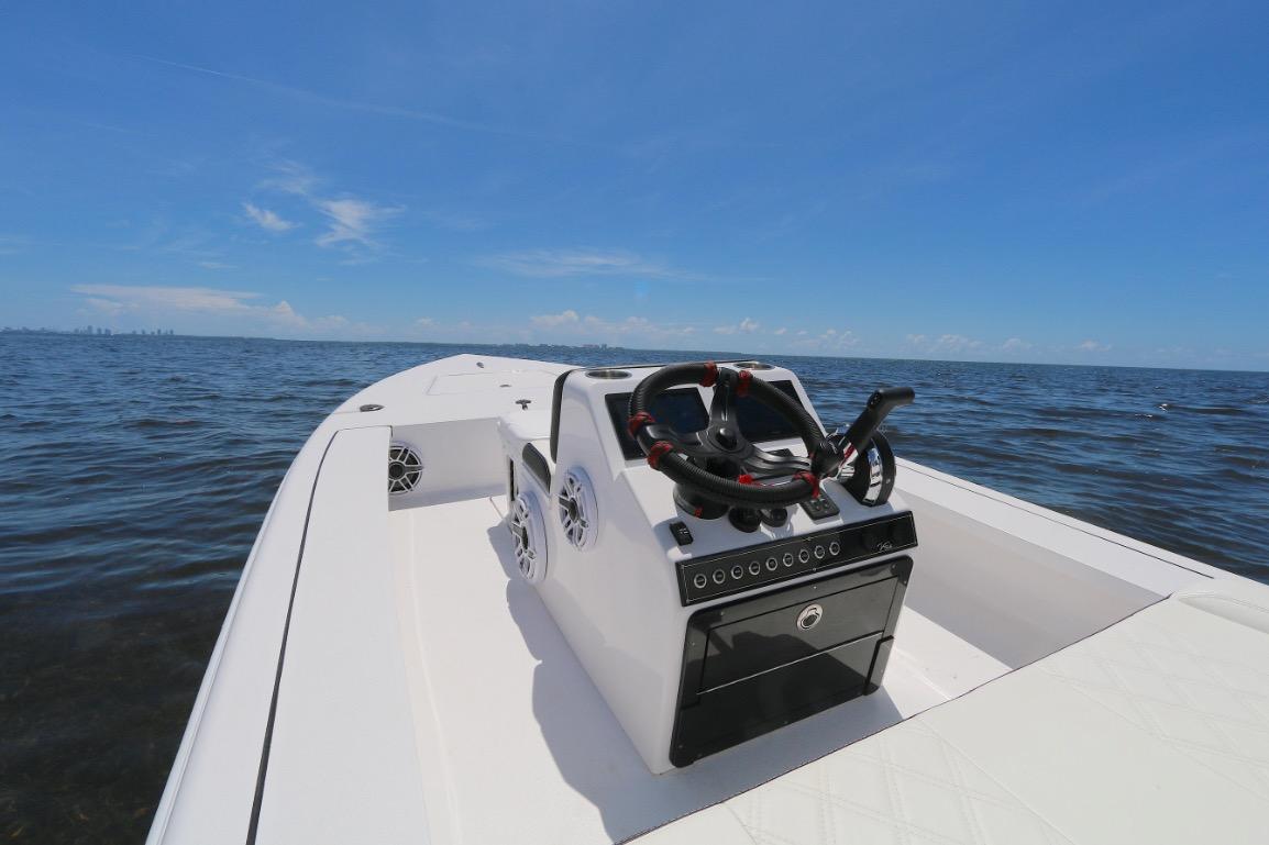2024 Vtech 18 boat on open water under clear blue sky.