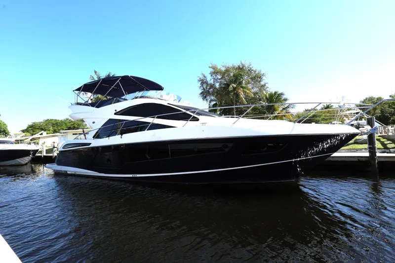  Yacht Photos Pics 2016 Sunseeker Manhattan 55 yacht docked, featuring sleek design and luxurious amenities.