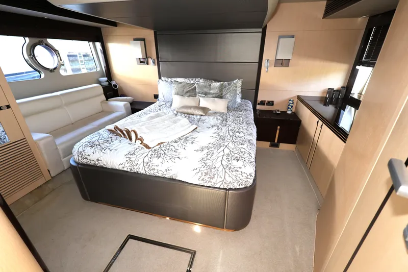  Yacht Photos Pics Luxurious bedroom interior of 2016 Sunseeker Manhattan 55 yacht with elegant decor.