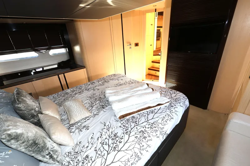  Yacht Photos Pics Luxurious bedroom interior of 2016 Sunseeker Manhattan 55 yacht with elegant bedding and modern decor.