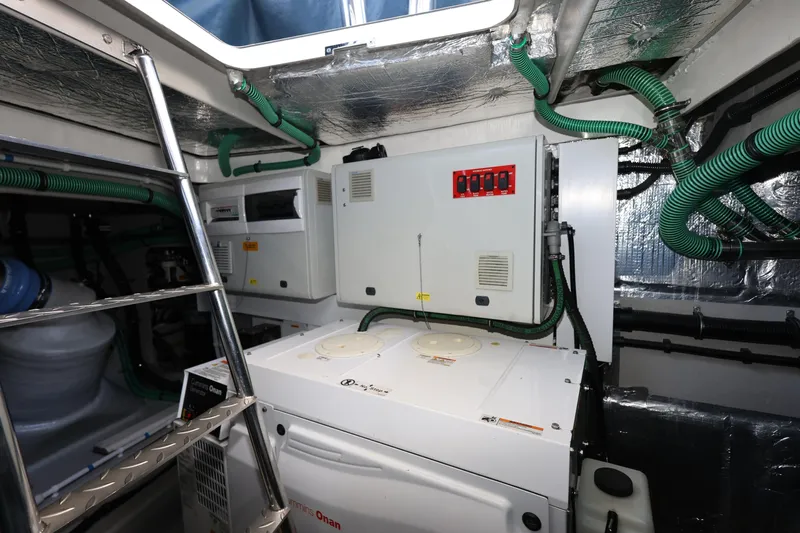  Yacht Photos Pics Engine room of 2016 Sunseeker Manhattan 55 yacht with Cummins Onan generator and control panels.