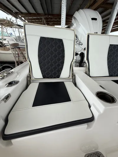  Yacht Photos Pics 2022 Tidewater 2700 Carolina Bay boat seats with black and white upholstery.