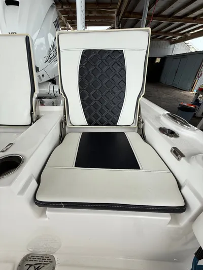  Yacht Photos Pics 2022 Tidewater 2700 Carolina Bay boat seat with black and white cushioned design.