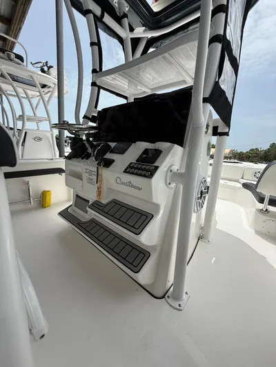  Yacht Photos Pics 2022 Tidewater 2700 Carolina Bay boat console with controls and seating.