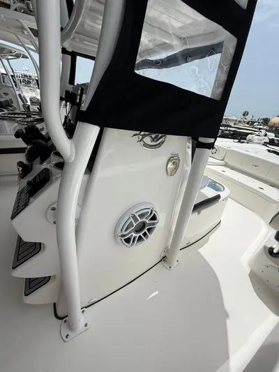  Yacht Photos Pics 2022 Tidewater 2700 Carolina Bay boat interior with console and speaker detail.