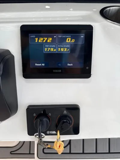  Yacht Photos Pics Yamaha display on 2022 Tidewater 2700 Carolina Bay boat dashboard showing trip data.