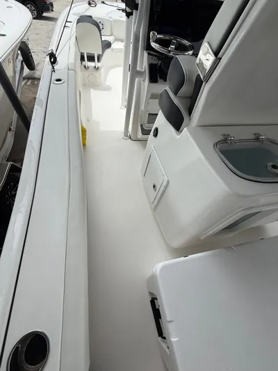  Yacht Photos Pics 2022 Tidewater 2700 Carolina Bay boat interior with seating and storage compartments.
