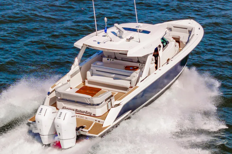 Always Saturday Yacht Photos Pics 2023 Tiara Yachts 43 LS cruising on open water, showcasing luxury design and powerful engines.